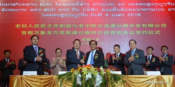 Representatives of the Laos-China Joint Expressway Development, China Yunnan Construction and Investment Holding Group (YCIH) and the Lao Planning and Investment Ministry attend a signing ceremony of a concession agreement for Laos' first expressway in Vientiane, Laos, April 4, 2018. (Xinhua/Liu Ailun) Representatives of the Laos-China Joint Expressway Development, China Yunnan Construction and Investment Holding Group (YCIH) and the Lao Planning and Investment Ministry attend a signing ceremony of a concession agreement for Laos' first expressway in Vientiane, Laos, April 4, 2018. (Xinhua/Liu Ailun)