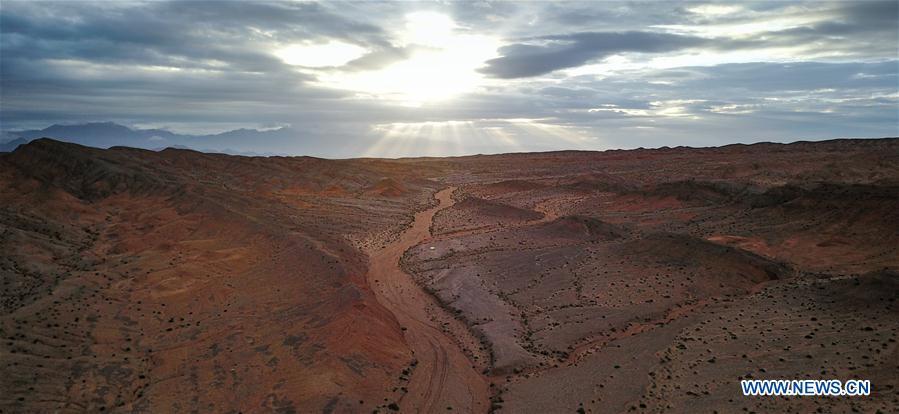 Photo taken on Aug. 18, 2017 shows red rock area of the Qaidam basin in Haixi of northwest China\'s Qinghai Province. China\'s project of building a village simulating the environmental conditions on Mars in Qinghai, as part of China\'s Mars exploration preparation, was approved by experts in Beijing Thursday. The red rock area of the Qaidam basin in western Qinghai has been dubbed \