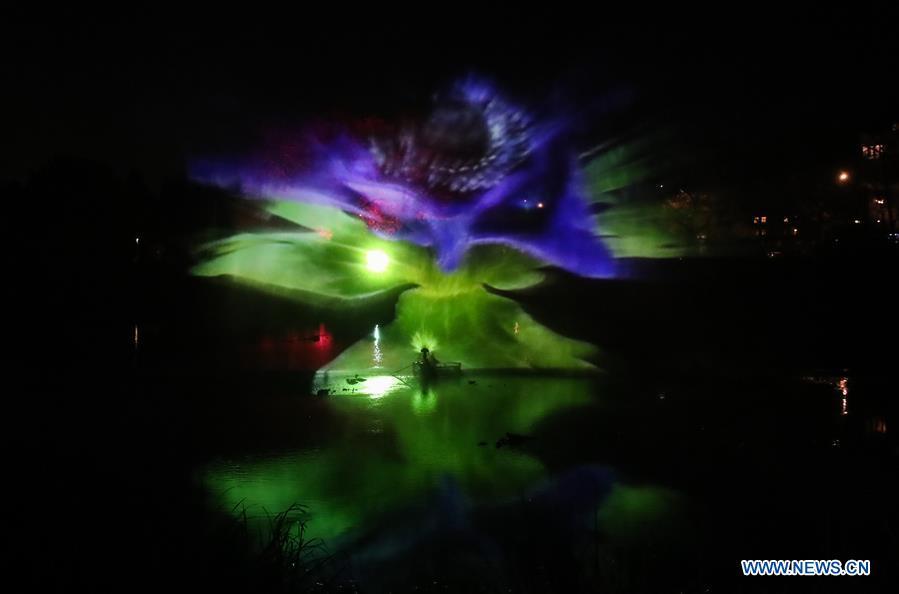 Photo taken on Nov. 15, 2018 shows a view of a light decoration through spray during the \
