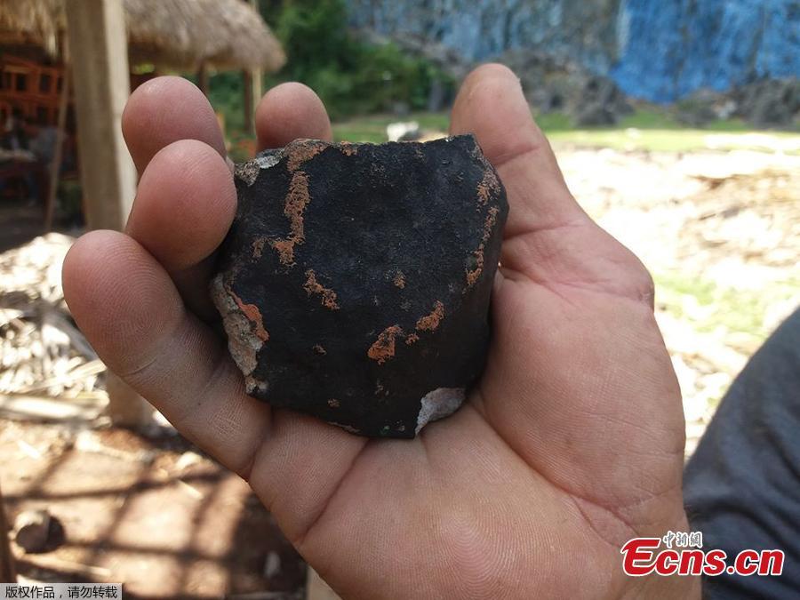 Handout picture released by Tele Pinar showing an alleged piece of a meteorite that fell in Cuba on February 1, 2019, taken in Vinalez, in the Cuban western province of Pinar del Rio. - The fall of a meteorite caused a strong explosion preceded by a flash that shook several municipalities in the Cuban province of Pinar del Rio, according to a member of the state astronomy institute.(Photo/Agencies)