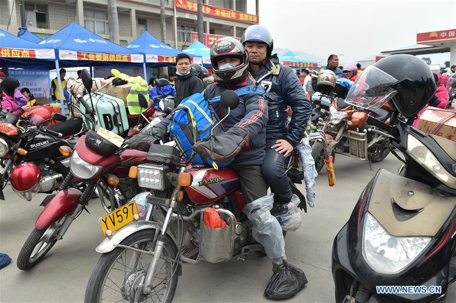Migrant workers in south China go home by motorcycle during Spring Festival travel rush